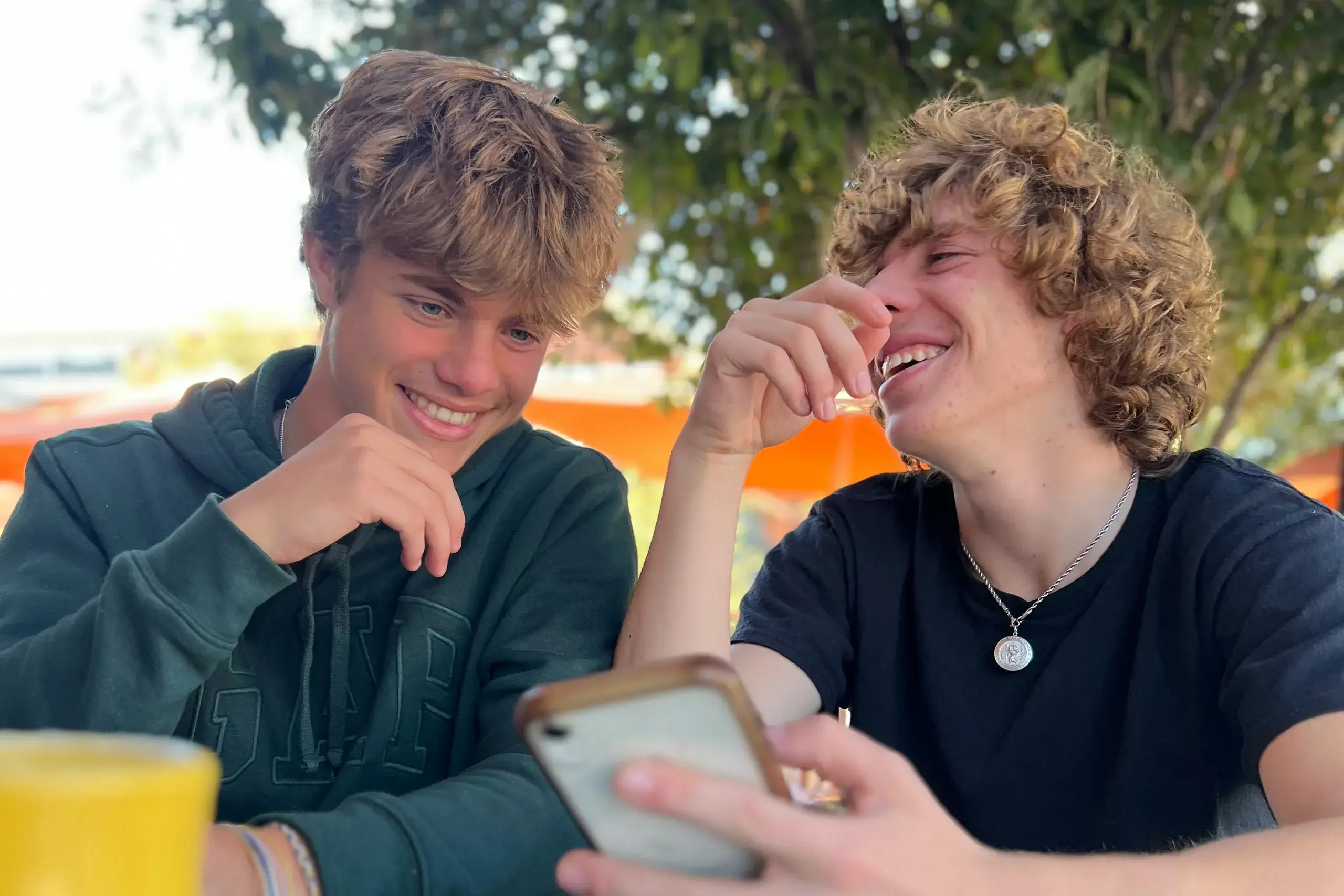 Two teenage friends smiling 