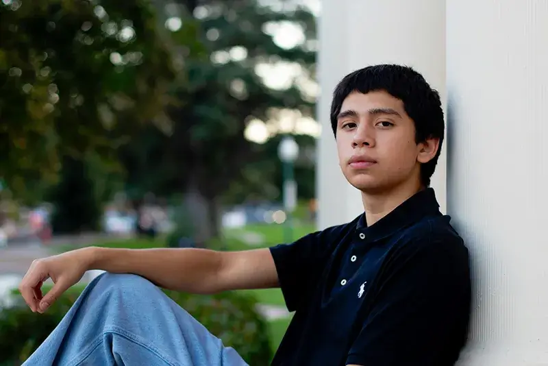 boy-sitting A teenager sitting on the ground