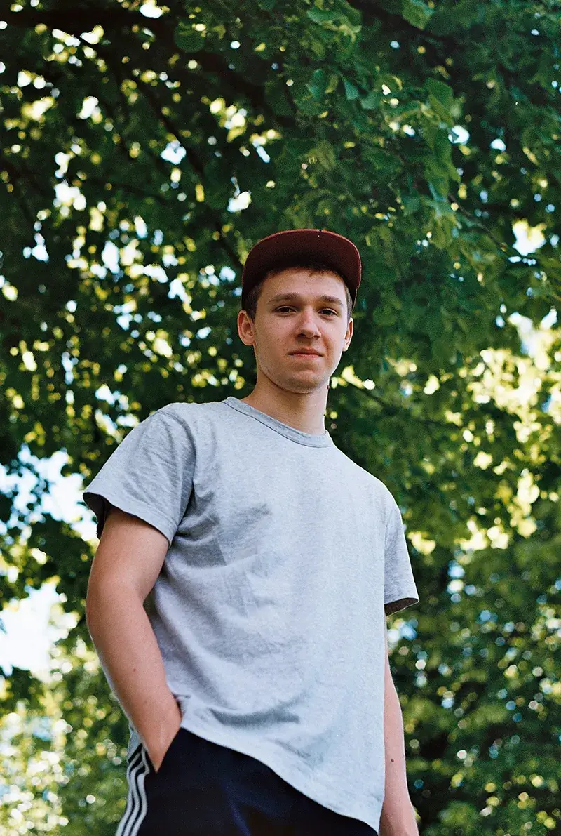 A teenage boy looking down