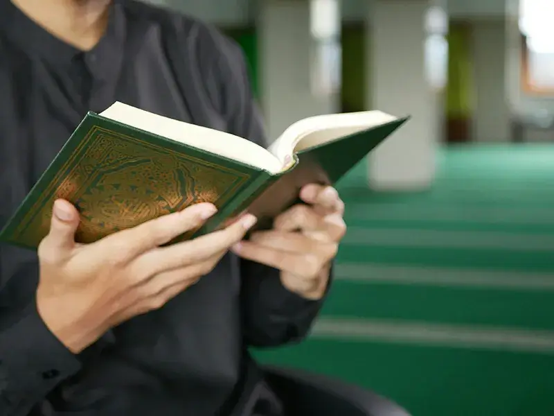 faith-leaders-1 A man holding the Quran