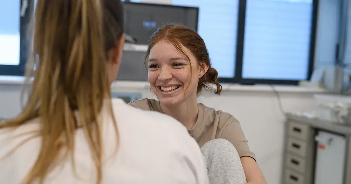 stick-to-facts A teenage girl talking with her doctor