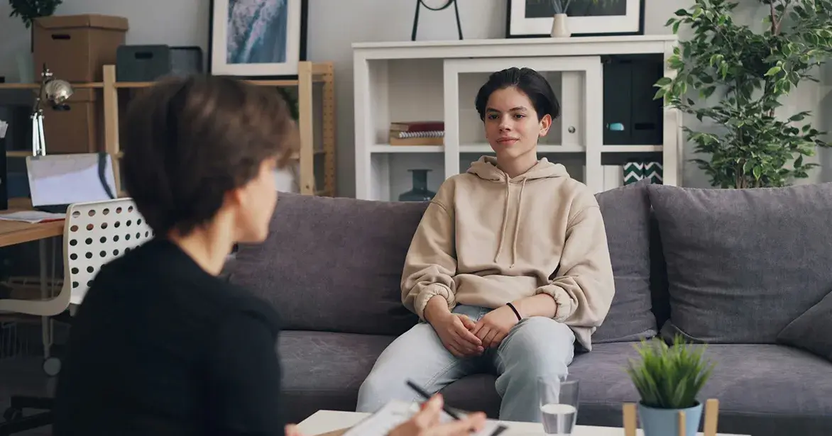 teen-on-couch Teen talking to therapist