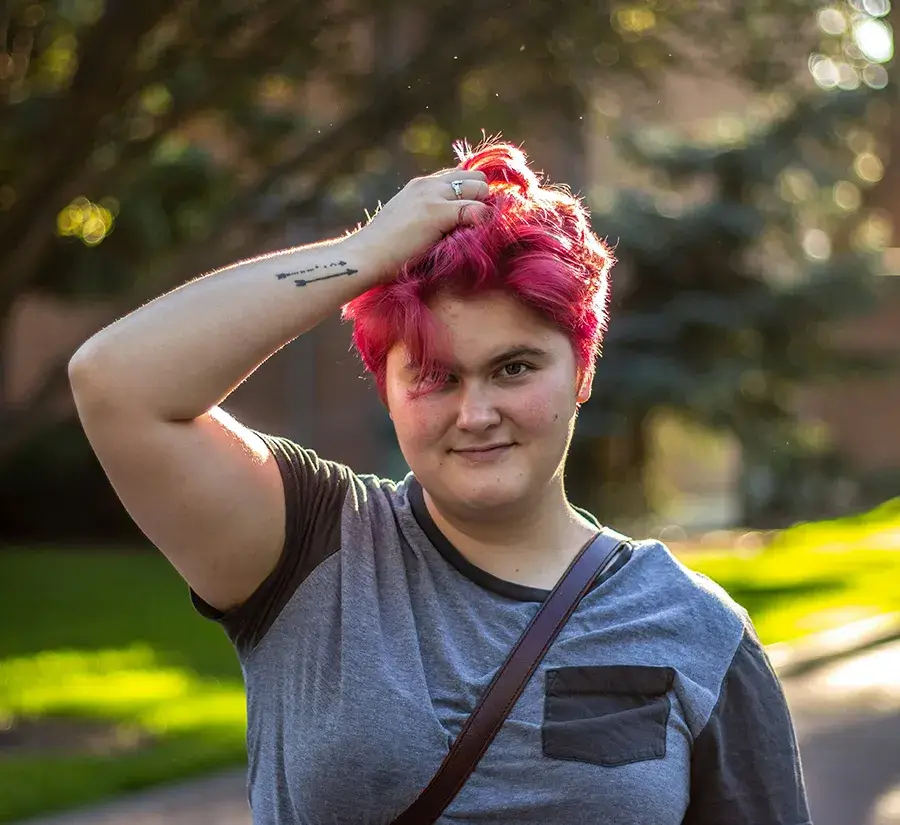 honest-data A young adult running hands through her hair