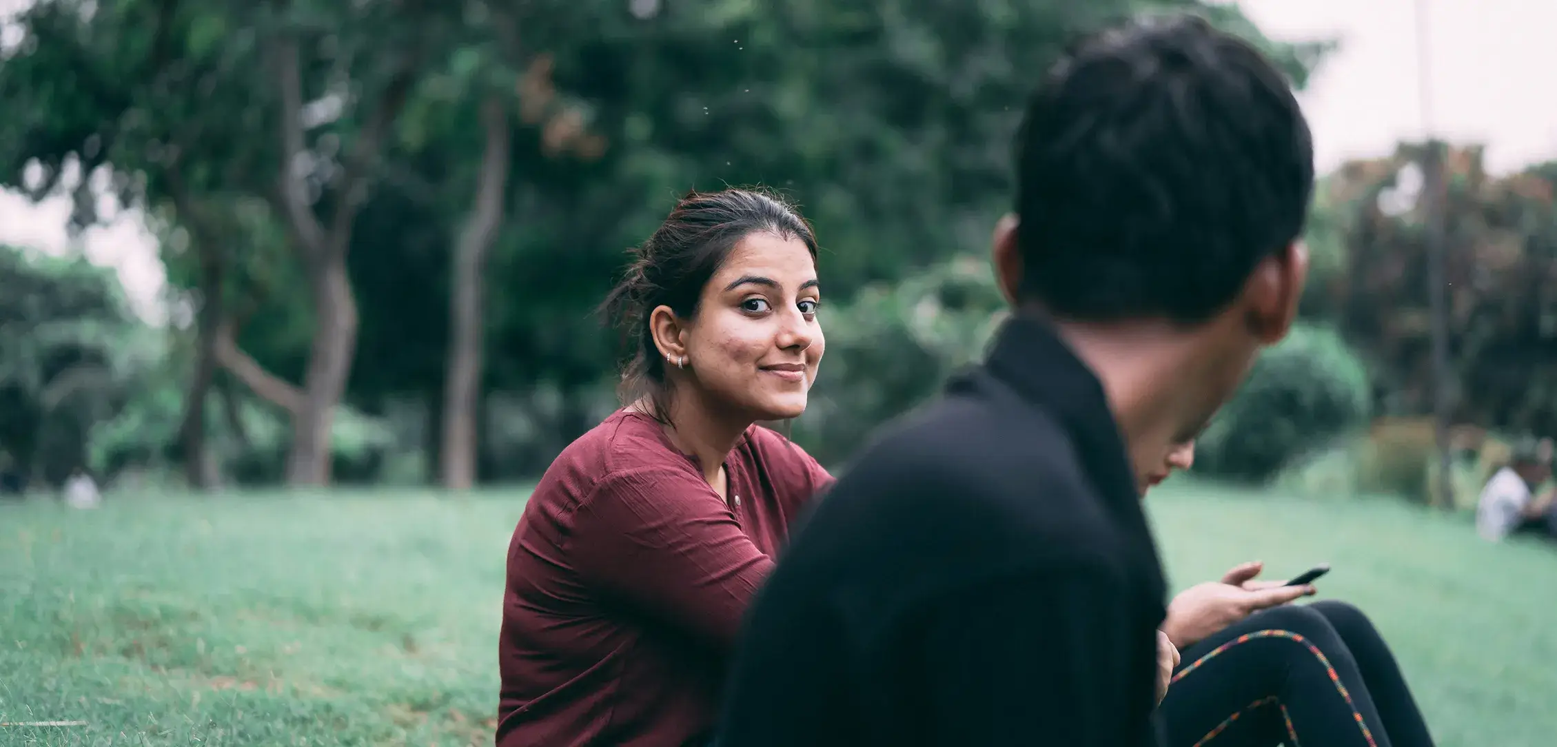 our-county-to-country A teen girl smiles while talking to friends