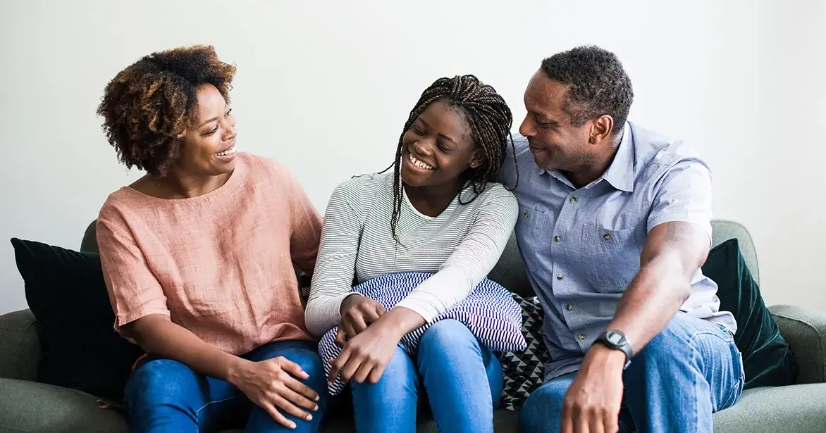 Relational Change Teen girl laughing with parents