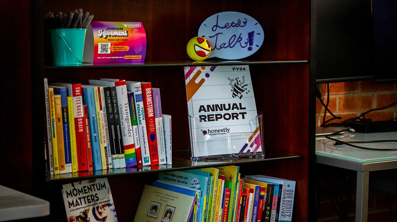 Support Youth-Serving Adults Books and signs in honestly office