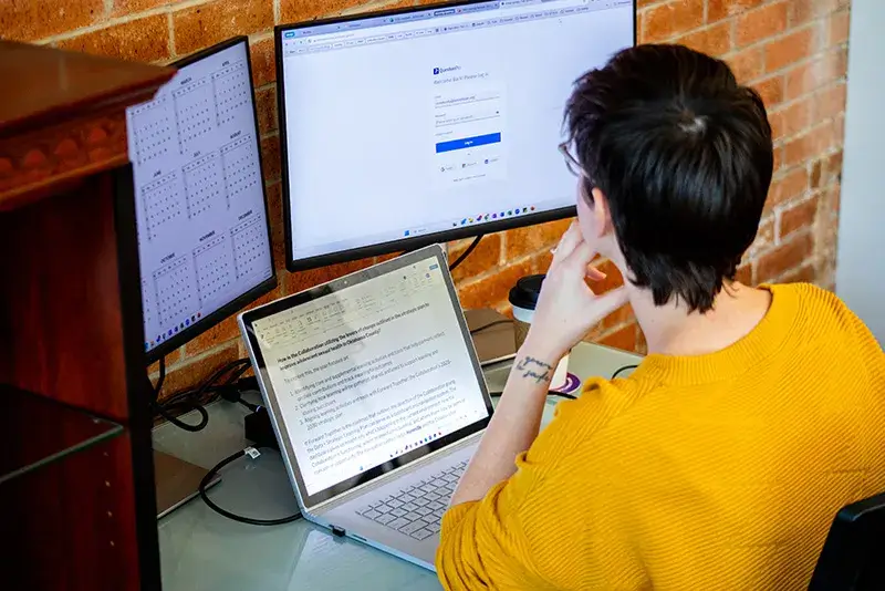 data-reports A woman looking at data on her computer