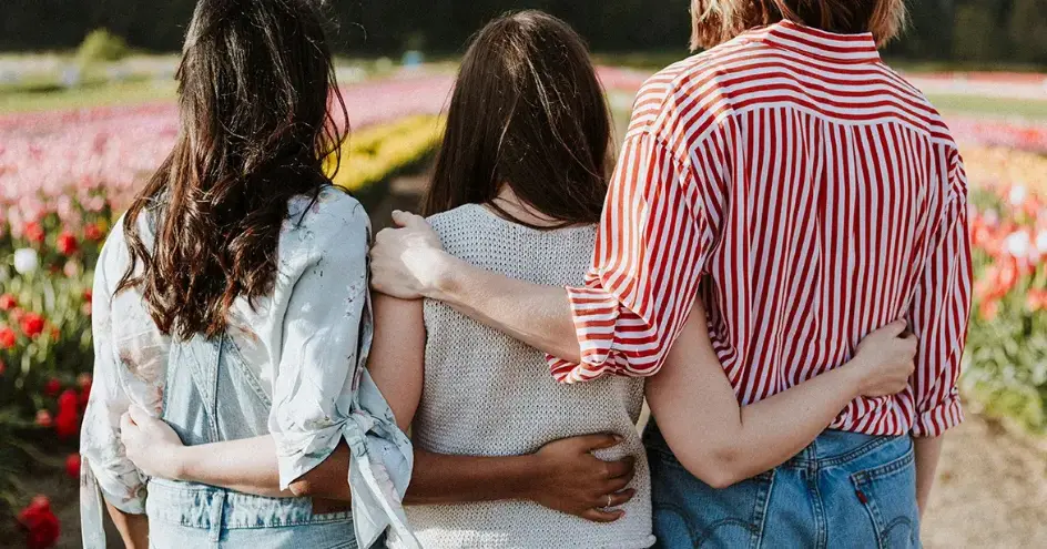 Friends standing together outside