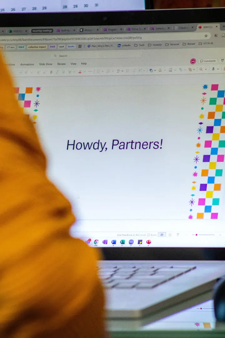 thank-yous A laptop screen showing a slideshow with "Howdy, Partners!" on the screen
